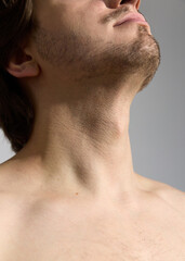 Naklejka premium a close portrait of a man with stubble, without outerwear. Photography of body parts