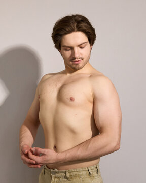 A man shows off his muscles, a real photo of people