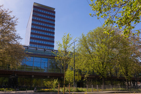 Amsterdam, Netherlands - 30 April 2026: Building of De Nederlandsche Bank - DNB stands tall in Amsterdam surrounded by green trees.