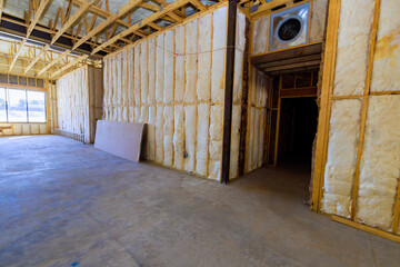 Construction site walls with insulation empty space in building during renovation