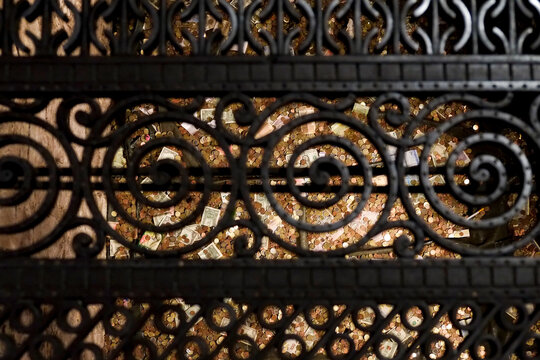 Decorative iron grate with coins for good luck
