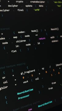 Multicolored programming code snippets and software scripts appear on a dark screen. Concept of vibe coding, artificial intelligence development, and futuristic software engineering.