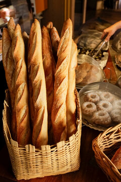 Fresh baguettes in basket at French bakery