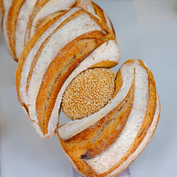 Artisan bread loaves with sesame seed topping