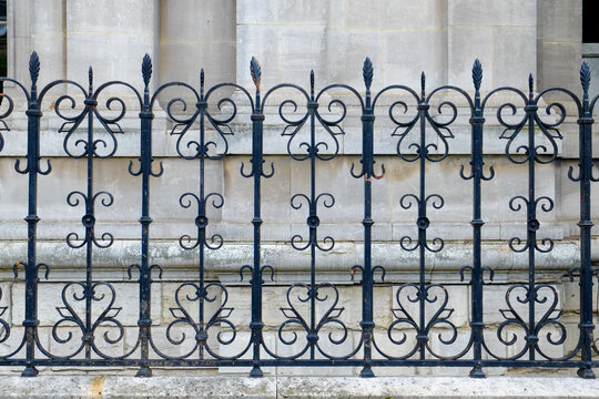 Decorative wrought iron fence detail in Paris