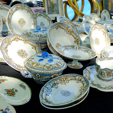 Antique porcelain plates and table ware  for sale at a Paris flea market 