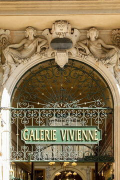 Metal gate and sign that reads Galerie Vivenne  in Paris