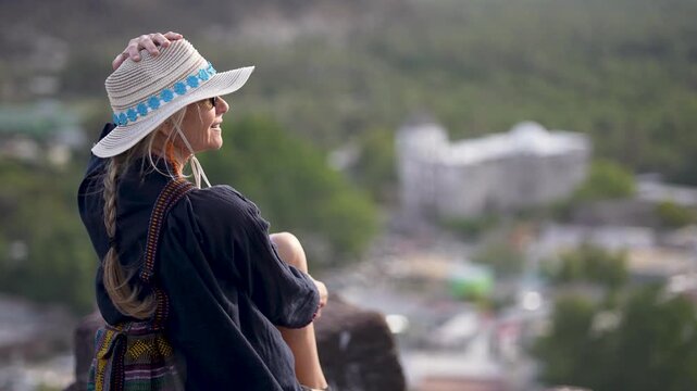 Mature woman explores the San Ignacio Mission in Baja California Sur while enjoying the views and local culture of the area.