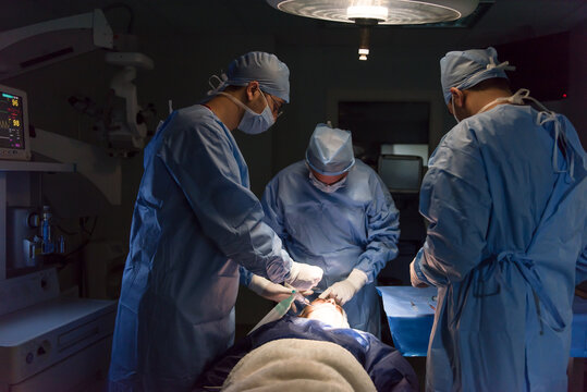 Ophthalmic surgery team of doctors performing eye operation in a modern Middle Eastern hospital in Egypt