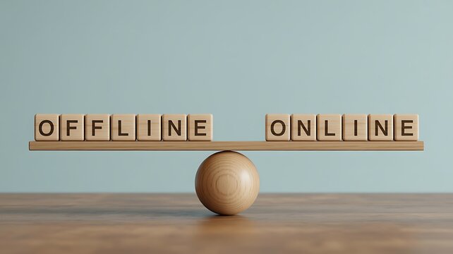 Wooden balance scale with offline and online blocks in equilibrium on a table