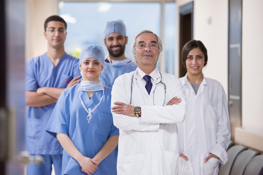 Experienced ophthalmology team at modern eye hospital in Egypt standing together in clinic hallway