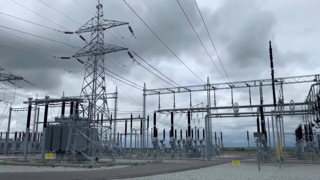 High voltage electrical power substation with transmission towers