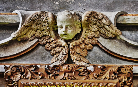 Baroque-style architectural detail of an angel face with wings in the San Matteo Church, Founded originally in 1125 by Martino Doria, in Genoa, Italy, Europe 