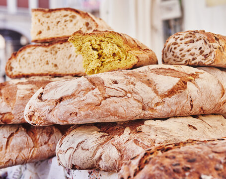 rustic artisan bread for sale at an open air market in Genoa, Italy, Europe