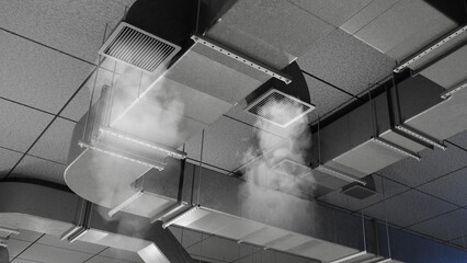 Fototapeta na wymiar HVAC ventilation, smoke leaks from ceiling air ducts during building system testing and maintenance inspection
