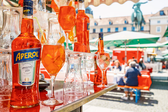 Munich, Germany - June 6: typical aperol bottle and glasses at a bar in Munich on June 6, 2025