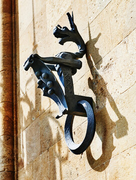 wrought iron torch bracket in the shape of a dragon along the wall of Castello Mackenzie (Mackenzie Castle) built 1893, in Genoa, Italy, Europe 