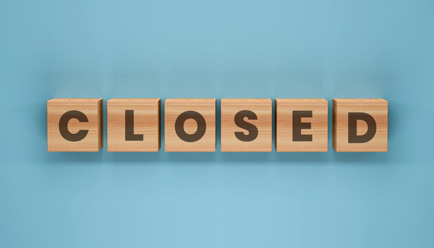 Closed Wooden Block Sign: A neat arrangement of wooden blocks spell out the word CLOSED, a sign of temporary unavailability or a message of finality. A clear blue background completes the image.