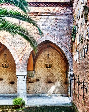 the inner arcaded courtyard of Castello Mackenzie (Mackenzie Castle), built 1893, located in the Castelletto quarter of Genoa, Italy, Europe 