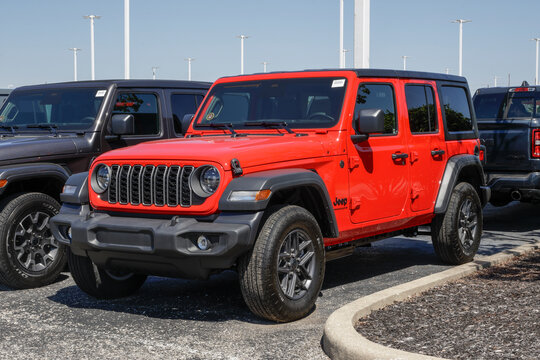 Jeep Wrangler 4-Door Sport S 4X4 display at a dealership. Jeep offers the Wrangler with a 2.0L I4 DOHC Turbo Engine. MY:2026