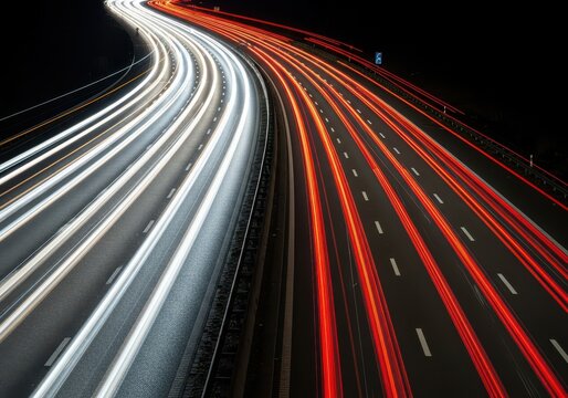 Long exposure photograph capturing the streaking red taillights and white headlights of thousands of vehicles navigating the congested motorway, volume, long exposure, rush hour