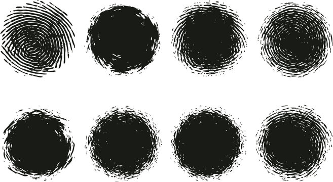 A collection of eight circular black grunge brush strokes isolated on a clean white background