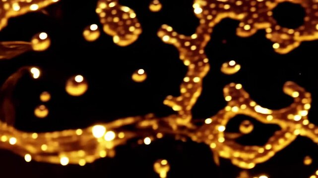 Golden Christmas tree and festive lights glow with a bright yellow sparkle and warm orange bokeh blur for a shiny holiday celebration Cinematic gold abstract background video