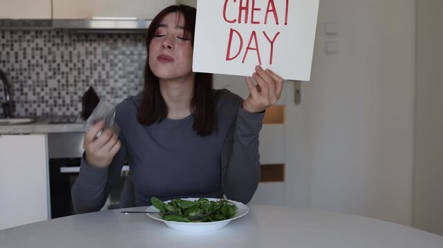 Woman enjoying cheat day with chocolate after strict healthy eating routine showing balanced attitude toward diet self care and realistic fitness lifestyle