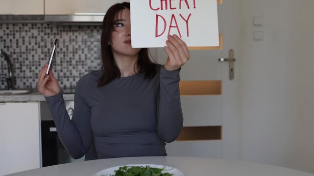 Young woman proudly enjoying cheat day with chocolate after healthy meals showing relaxed modern fitness mindset where balance and happiness matter more than strict diets