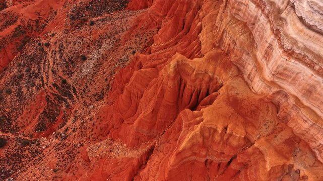 Arid red rocks with no vegetation on. Drone footage over the stunning canyons of Teruel, Spain.