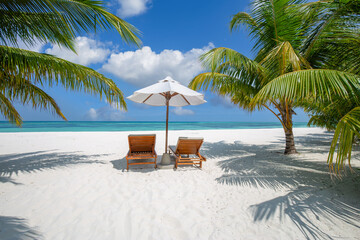 Fototapeta premium Beautiful panoramic ocean sand sky view with tropical relax beach sunny summer island landscape featuring love couple chairs umbrella and palm leaves on romantic coast for luxury travel getaway