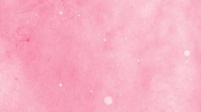 Pink background with white dots and a soft focus effect appears