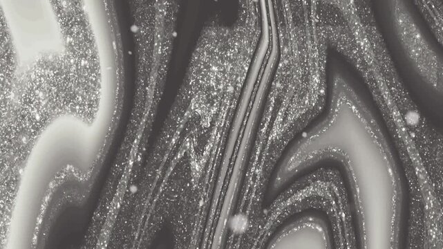 A close-up black and white photo shows a detailed agate stone with sparkling crystals and swirling patterns.