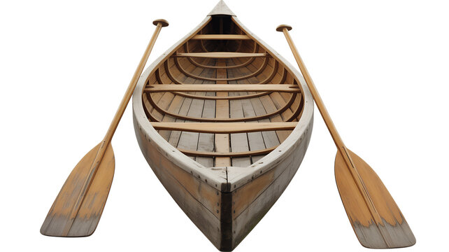 Wooden canoe with oars detailed view against black background.