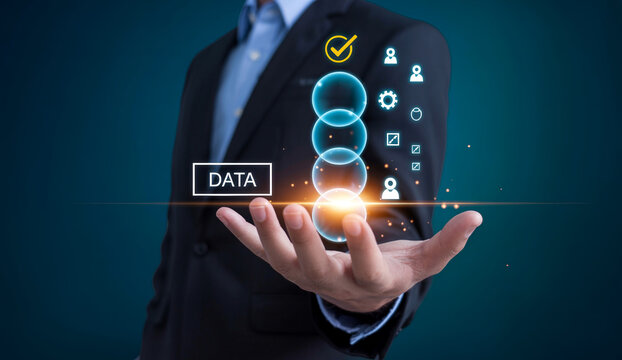 Businessman holding glowing data bubbles with check mark and analytic icons over dark blue background.