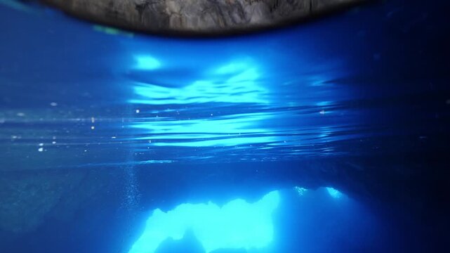 scuba divers exploring caves underwater cave diving