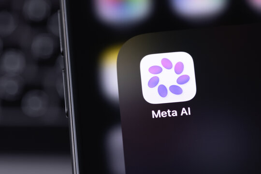 Meta AI icon mobile app on a screen smartphone iPhone closeup. Meta AI is an AI-powered virtual assistant developed by Meta Platforms. Batumi, Georgia - March 25, 2026