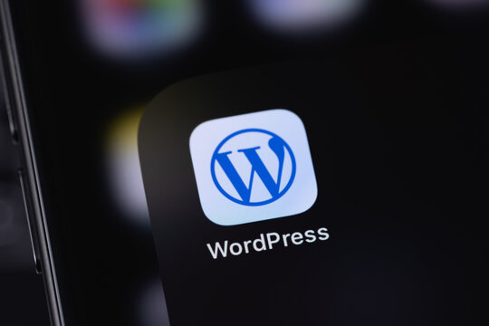 WordPress logo mobile icon app on a screen smartphone iPhone closeup. WordPress - open source site content management system. Batumi, Georgia - March 25, 2026