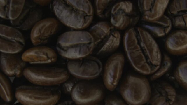 Rotating Coffee Beans Abstract Macro Background.
