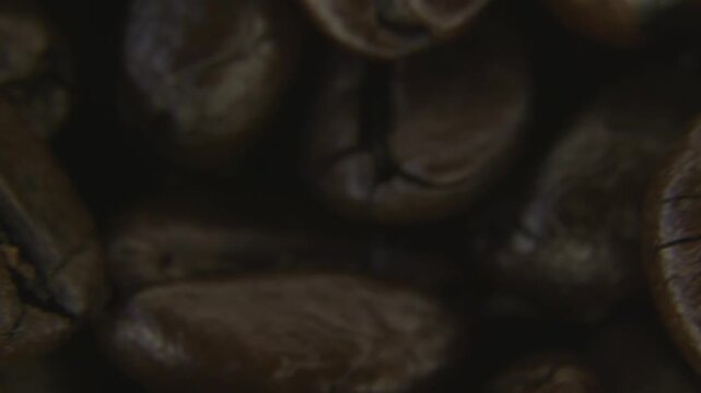 Rotating Roasted Coffee Beans Close Up Macro.