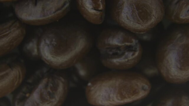 Macro Rotation of Roasted Coffee Beans Texture.