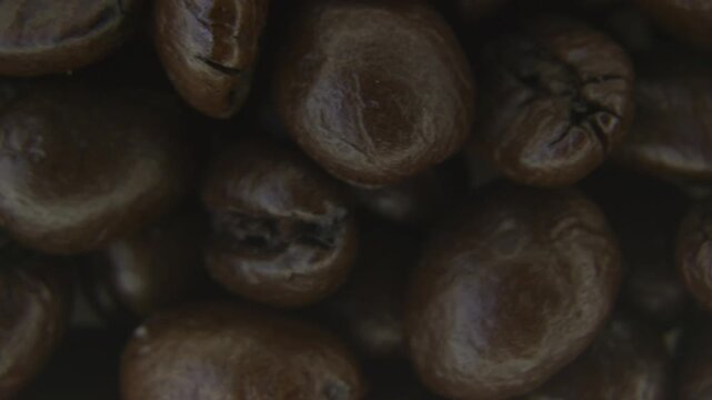 Rotating Coffee Beans Macro Texture Background.