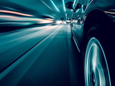 Side view of a Car driving along a motorway at speed, Illinois, USA