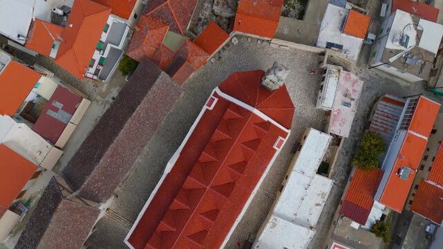 Top Down Drone Aerial of Holy Cross Monastery Courtyard and Roofs in Omodos Cyprus