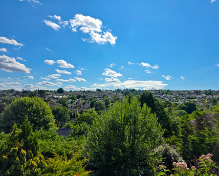 Panoramic view of Nailsworth in the Cotswolds, England under sunny blue sky