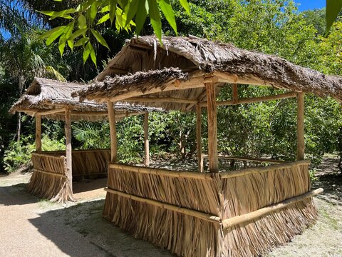 Palm leaf gazebos at the entrance to Vallee de Mai National Park (UNESCO World Heritage Site) in central Praslin Island, Seychelles