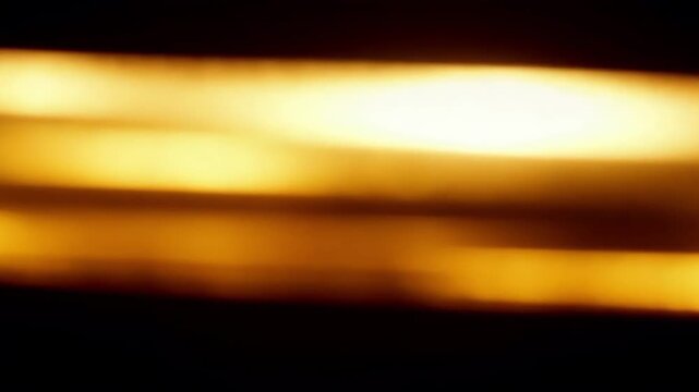 Night fire with glowing flames and bright light Premium gold abstract background video