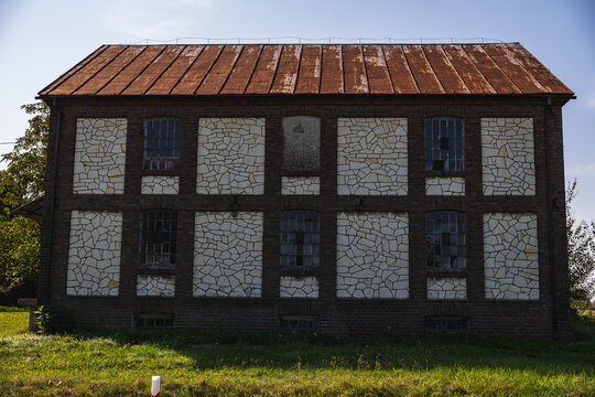an old abandoned granary or mill built of stone and brick