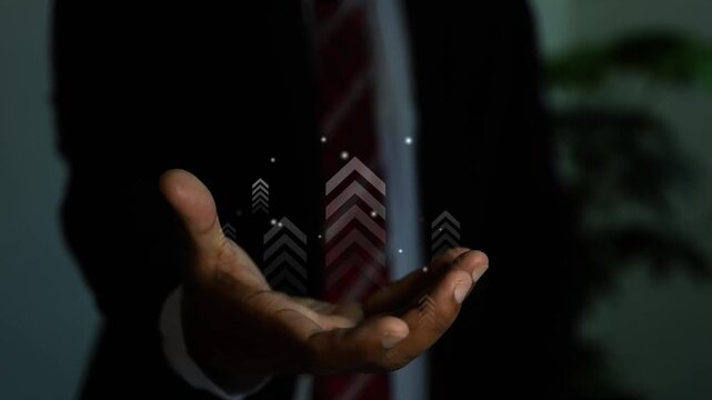 Businessman hand holding growing up arrow bar on virtual screen