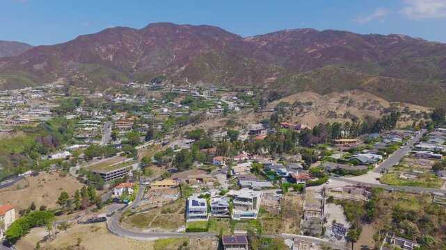 Pacific Palisades Hillside Aerial Pullback View of Homes and Mountains 02